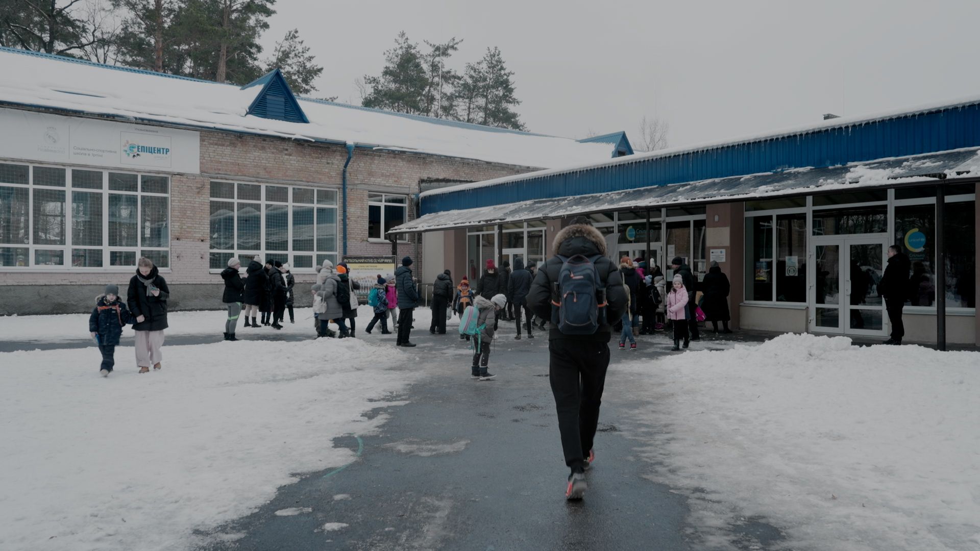 Students returning to a recently reopened school in Ukraine