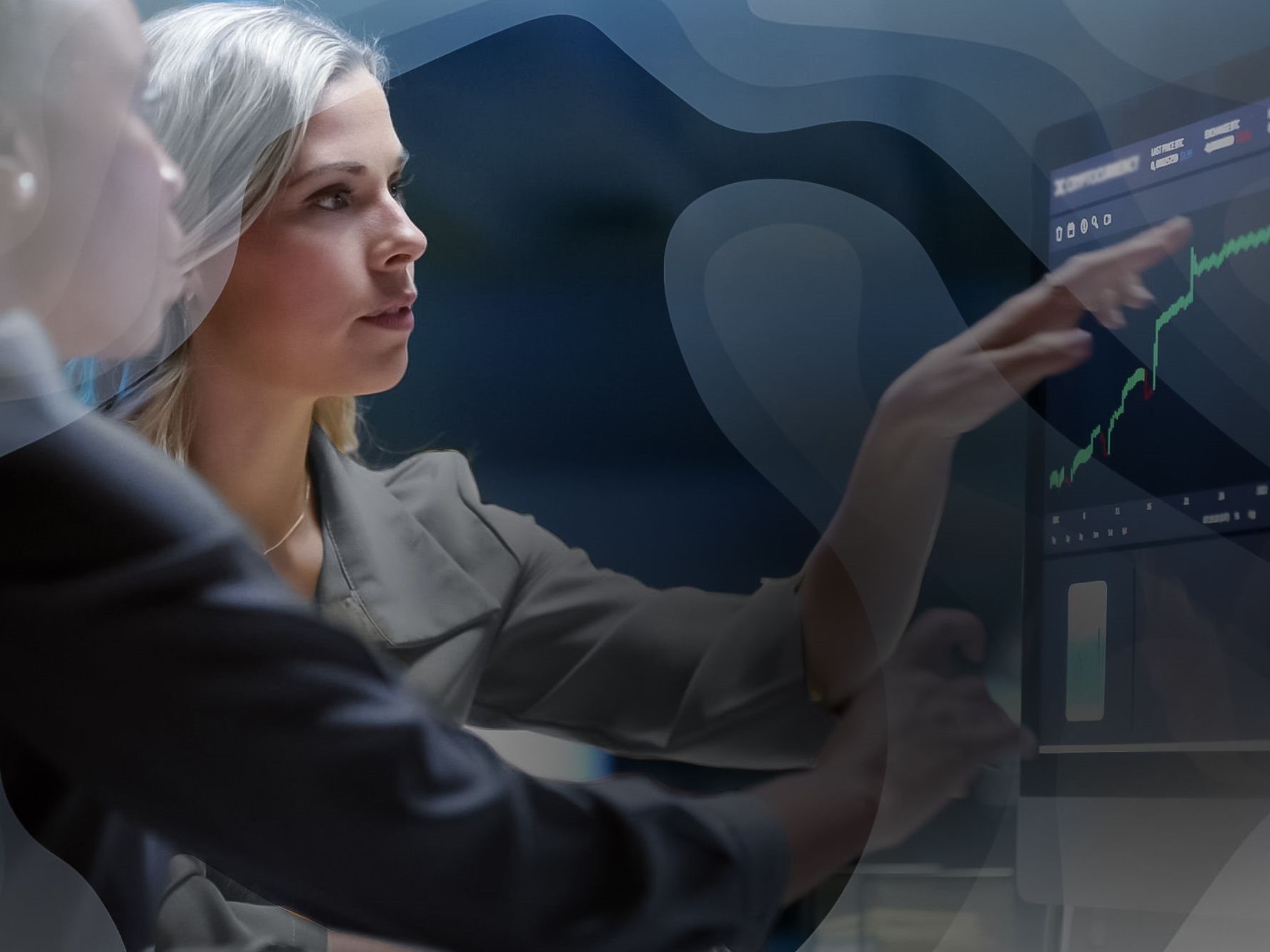 two people analyze a positively trending graph