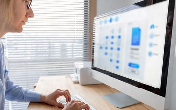Women looking at a computer screen for systematic literature review